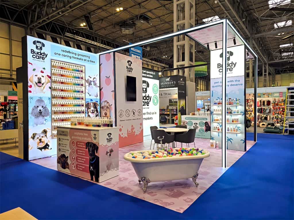 Modular exhibition stand featuring recessed and floating shelving integrated within a T3 framework, illuminated with LED lighting for product display at a trade show